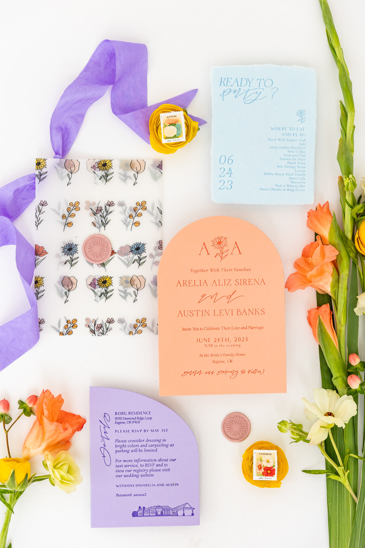 A flatlay of an invitation suite by Life in Letters